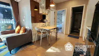 Charming and well-lit corner unit with a spacious open layout living room, featuring elegant marble accents and a cozy dining area that seamlessly blends modern living with comfort.