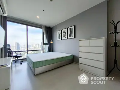 Modern bedroom with city view, minimalist decor, and ample natural light