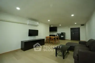 Spacious modern living room with sleek furniture and open layout