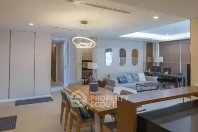 Spacious modern living room with elegant dining area and stylish decor