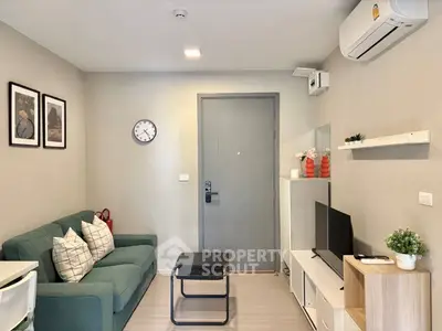 Modern living room with stylish decor, featuring a cozy sofa, wall-mounted TV, and air conditioning.