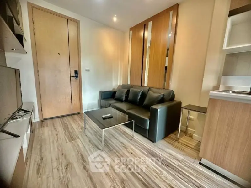 Modern living room with sleek design and wooden flooring