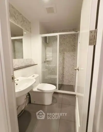 Modern bathroom with sleek design and glass shower enclosure