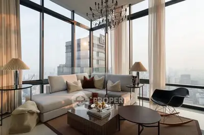 Luxurious corner living room with panoramic city views and modern decor.