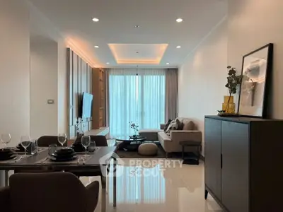 Elegant modern living room with dining area, featuring stylish furniture and ambient lighting.