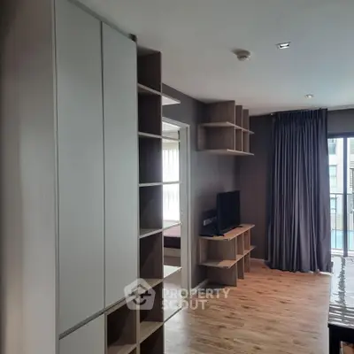 Modern living room with sleek shelving and natural light