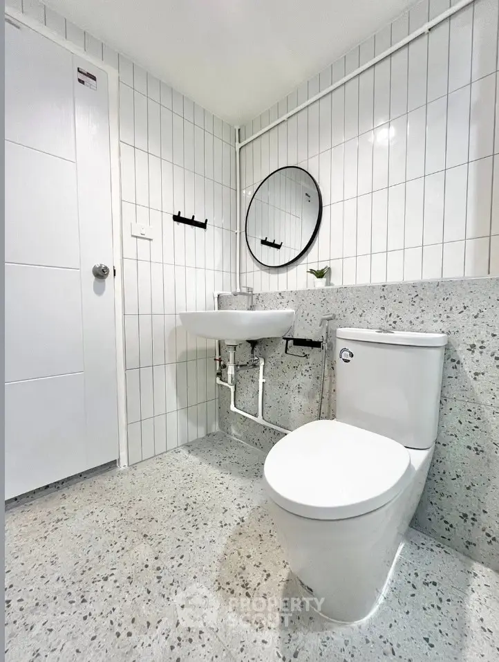 Modern bathroom with sleek fixtures and minimalist design.