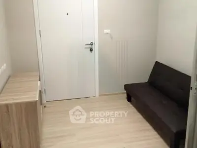 Cozy entryway with modern furniture and sleek design, perfect for welcoming guests.