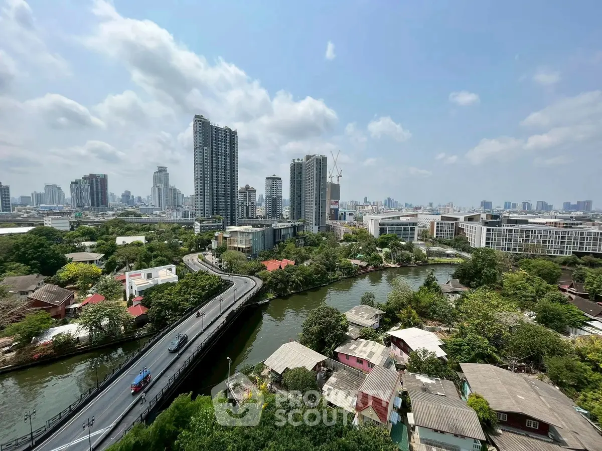 Stunning cityscape view with river and high-rise buildings, perfect urban living.