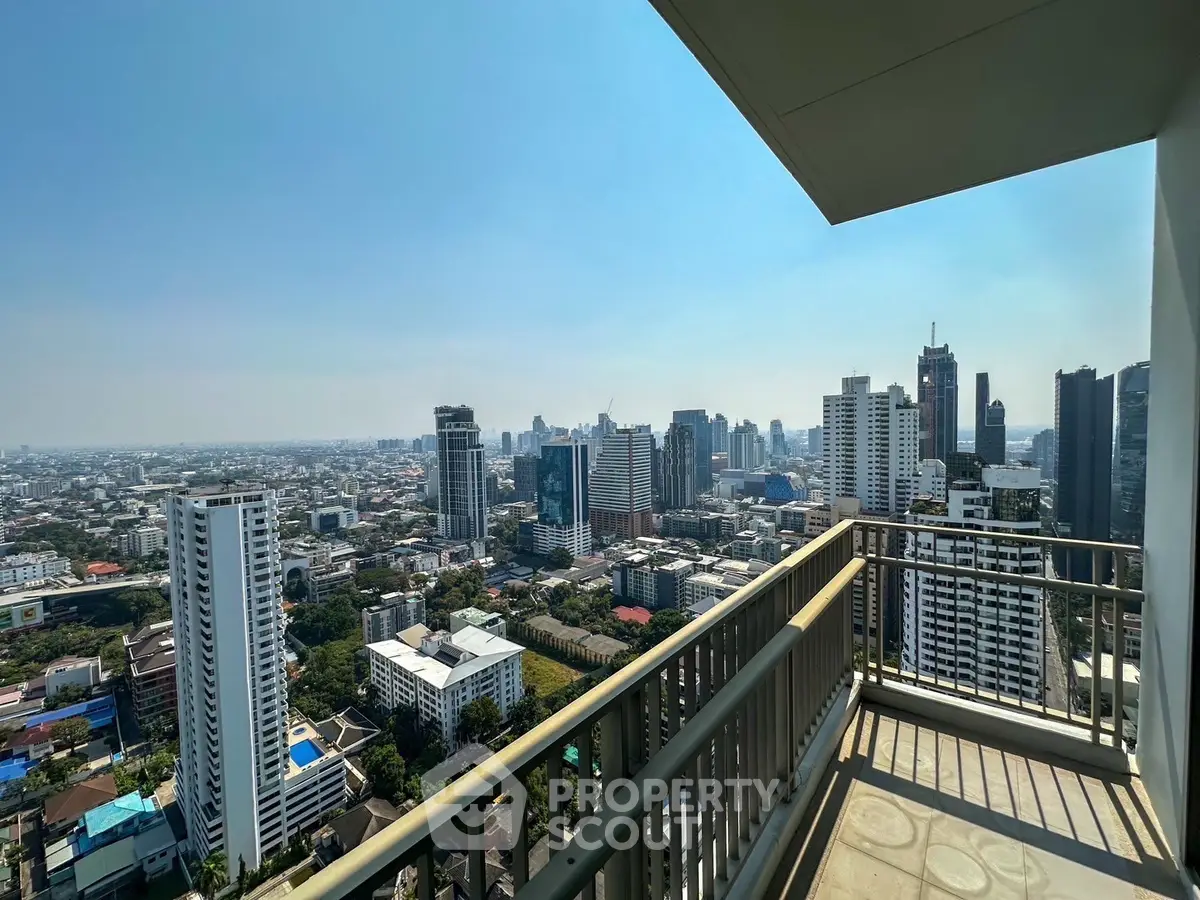 Stunning cityscape view from high-rise balcony with expansive skyline and urban landscape.