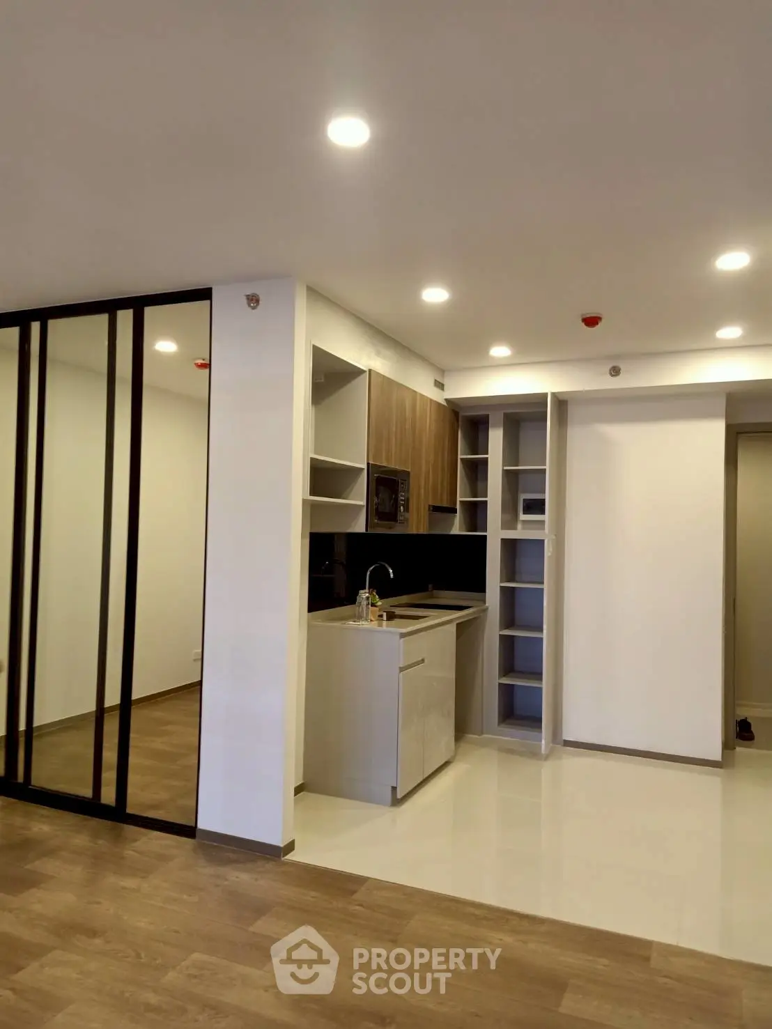 Modern kitchen with sleek cabinetry and open layout in a stylish apartment