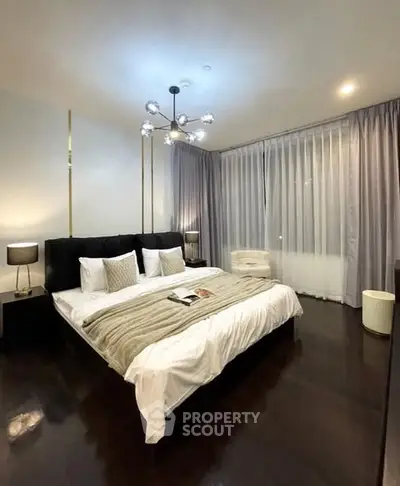 Luxurious bedroom with modern lighting and elegant decor