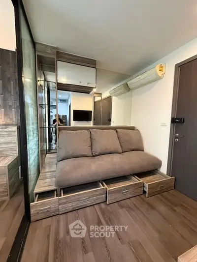 Modern compact living room with built-in storage and sleek design