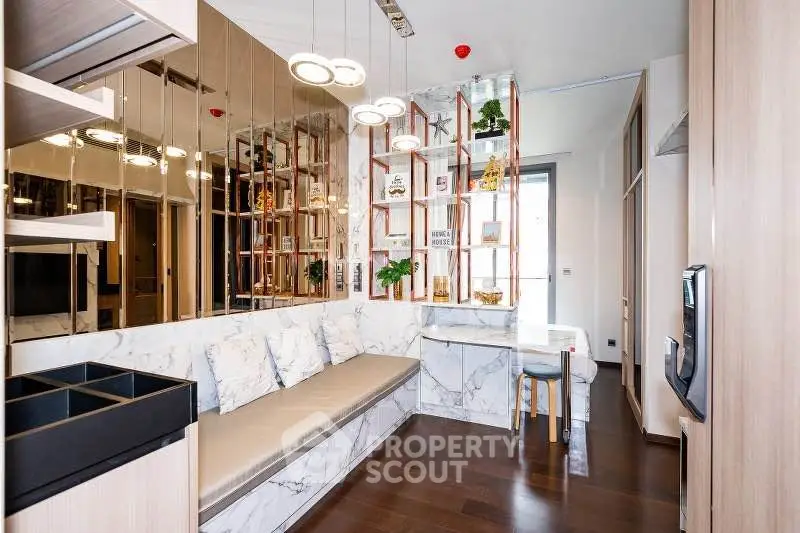 Modern living room with stylish marble accents and cozy seating area