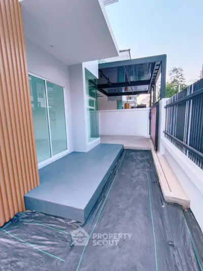 Modern balcony with sleek design and spacious layout, perfect for outdoor relaxation.