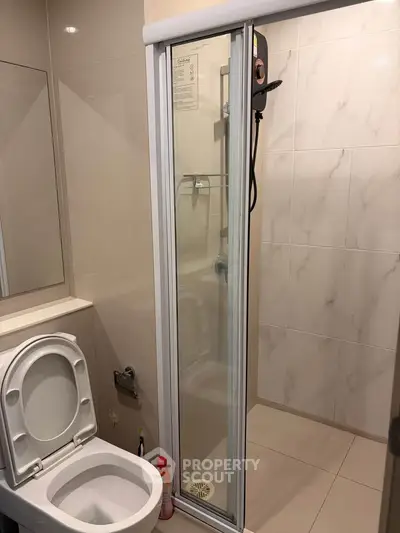 Modern bathroom with shower and toilet in sleek design