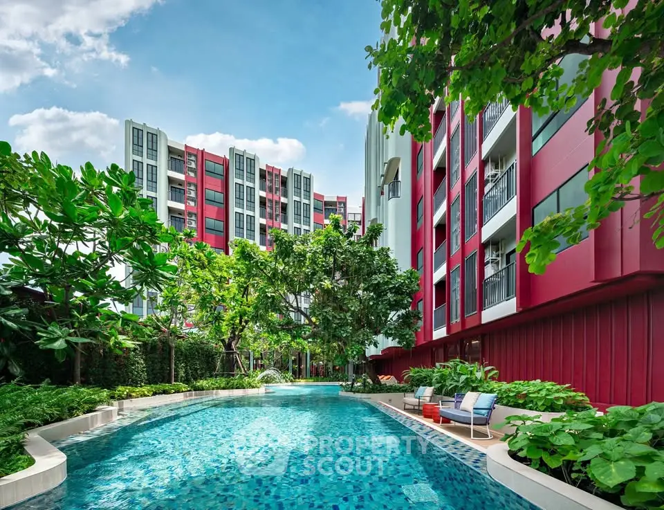 Luxurious condominium with stunning pool and lush greenery, perfect for modern living.
