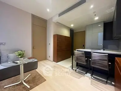 Modern open-plan living room with sleek kitchen and stylish furniture