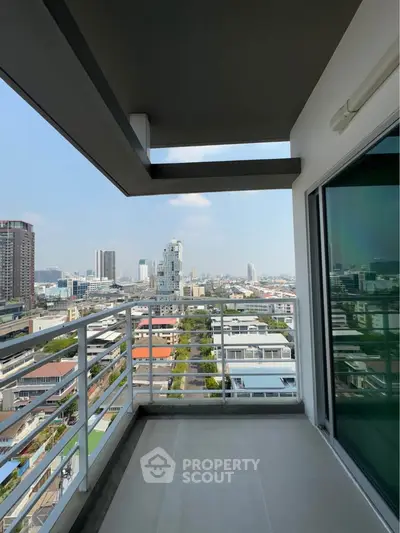 Spacious balcony with stunning city view in modern apartment