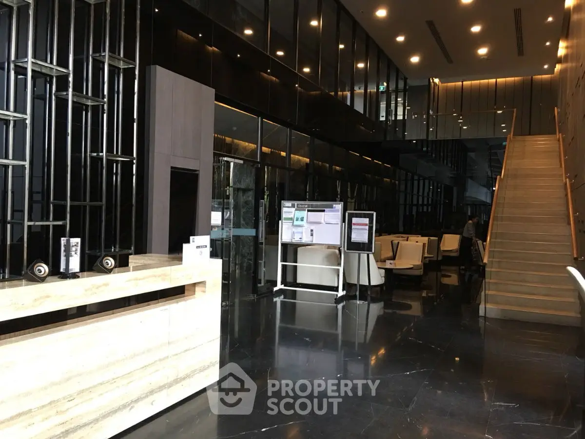 Luxurious modern building entrance with sleek design and elegant lighting