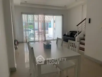 Spacious modern living room with dining area and natural light
