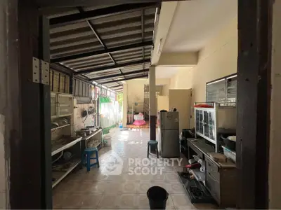 Spacious kitchen with open layout and natural light, featuring modern appliances and ample storage.