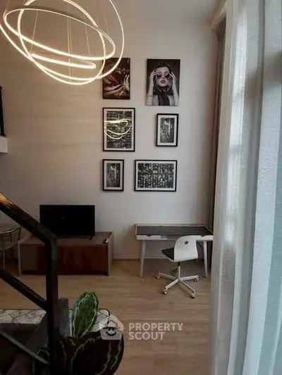 Modern living room with stylish decor and unique lighting fixture