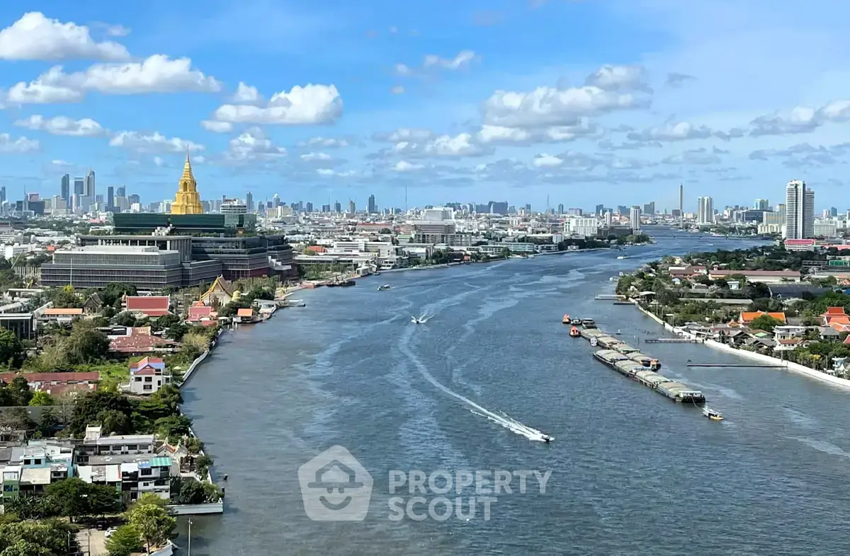 Stunning river view with city skyline and iconic golden temple, perfect for urban living enthusiasts.