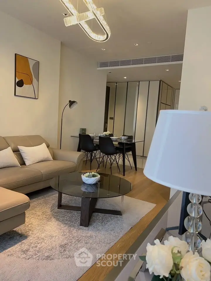 Modern living room with stylish decor and cozy seating area, perfect for relaxation and entertaining.