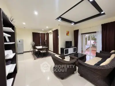 Spacious living room with elegant wicker furniture and modern decor