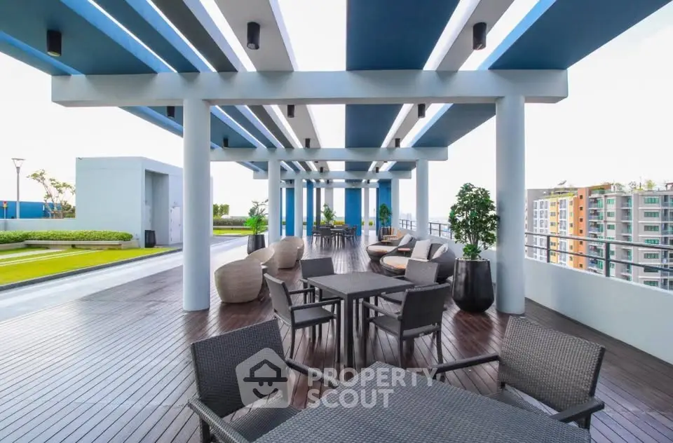 Luxurious rooftop terrace with modern seating and stunning city views.