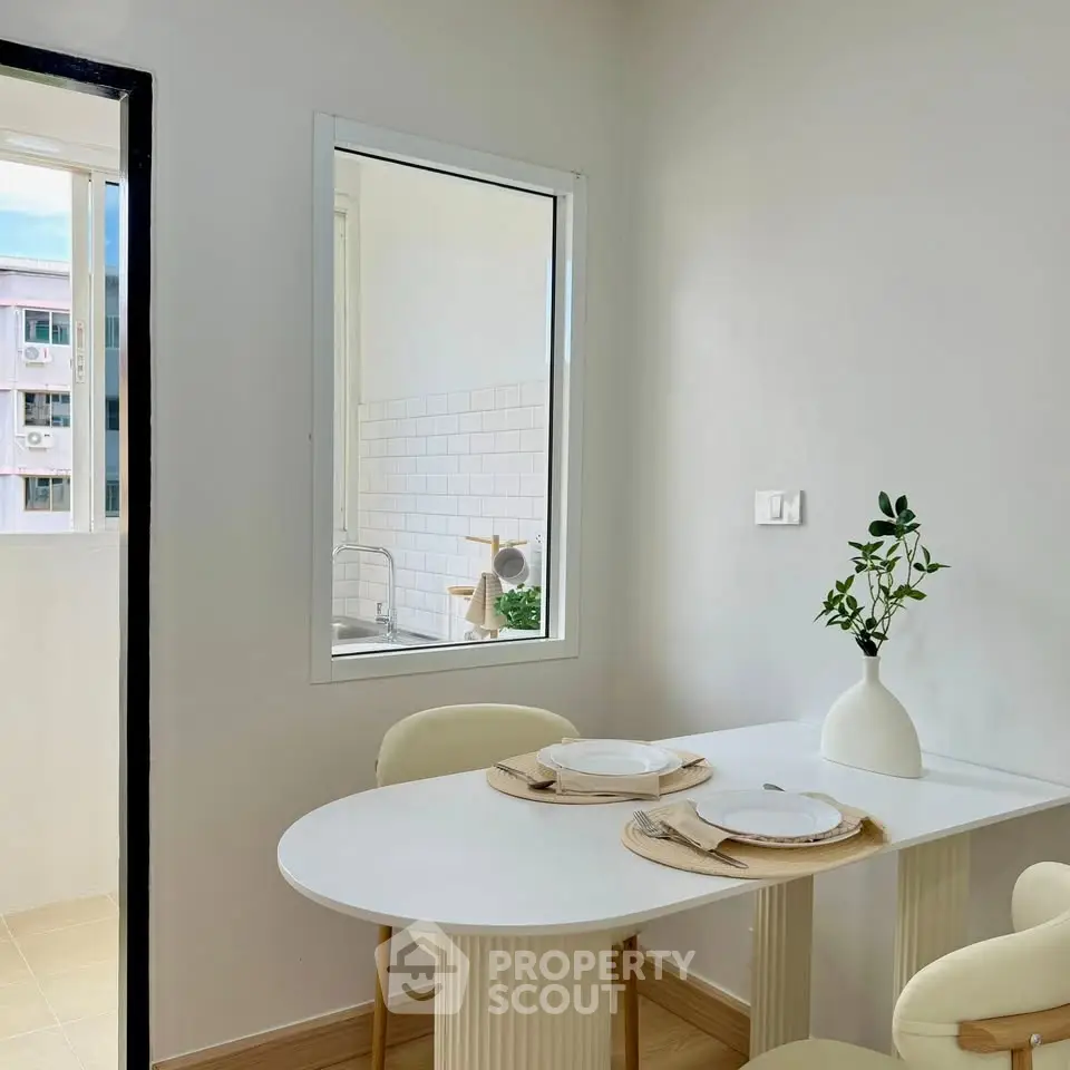 Chic dining area with minimalist decor and natural light