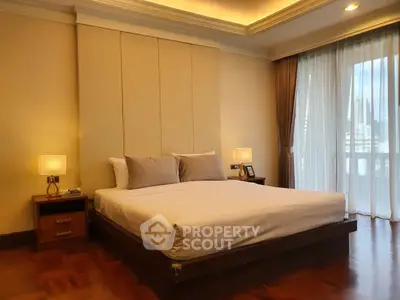 Luxurious bedroom with elegant lighting and city view