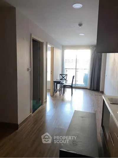 Modern apartment interior with wooden flooring and natural light