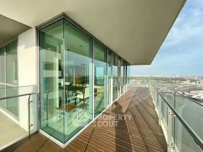 Stunning corner unit with expansive balcony and panoramic city views.