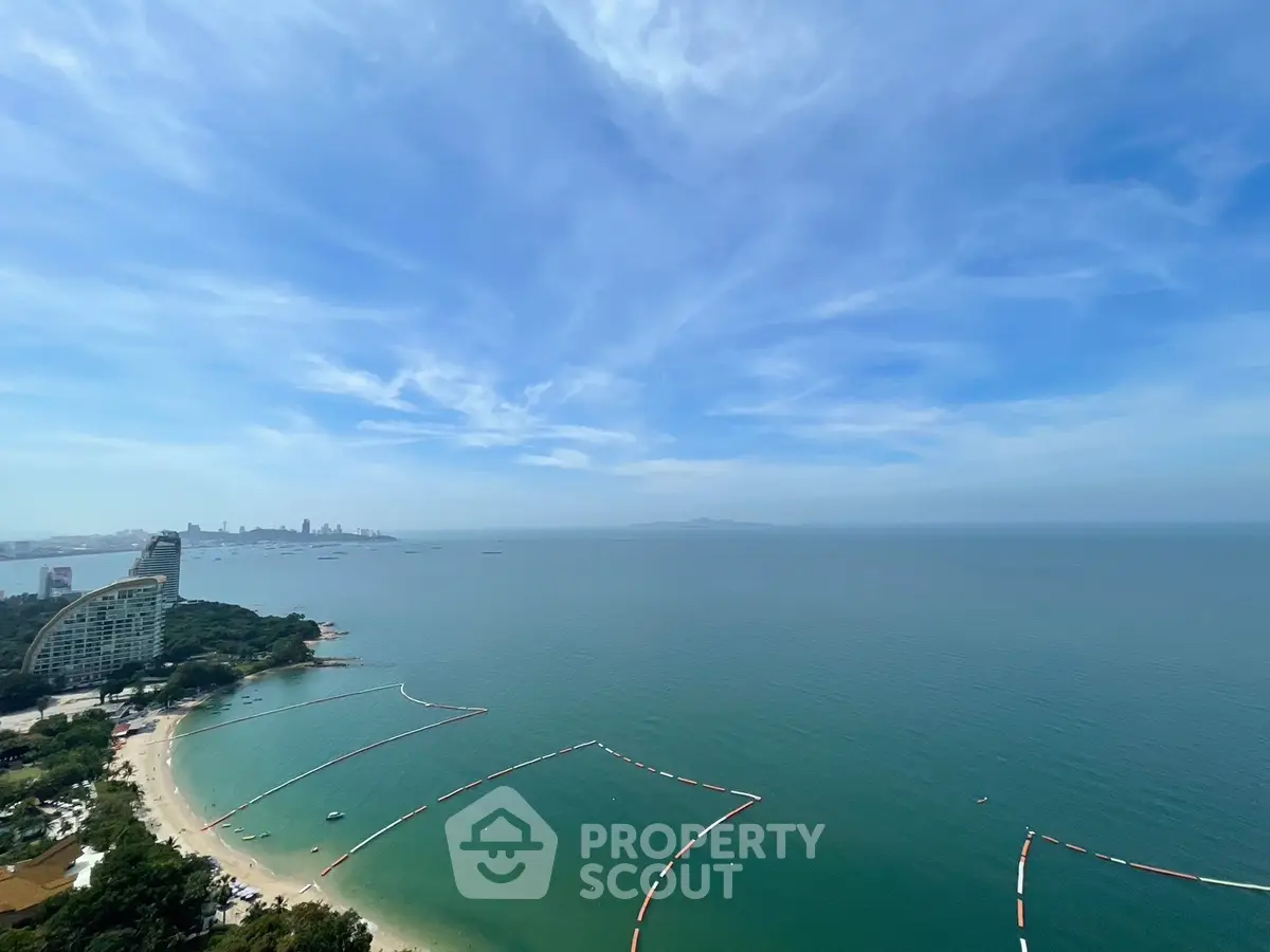 Stunning ocean view from high-rise building with clear blue skies
