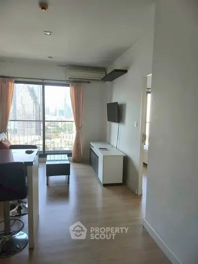 Modern living room with city view, sleek furniture, and natural light.
