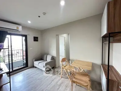 Modern living room with balcony access and stylish furniture