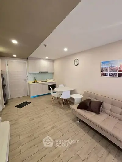 Modern living room with open kitchen and stylish furniture