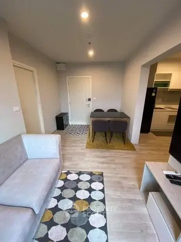 Modern living room with stylish decor and open kitchen layout