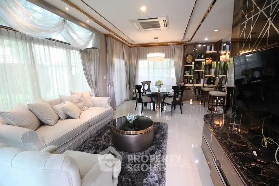 Luxurious living room with elegant decor and large windows