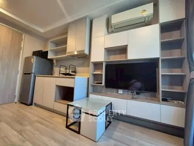 Modern living room with sleek furniture and built-in storage