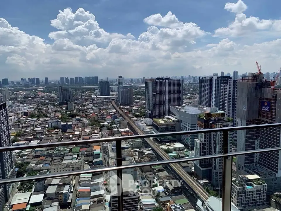Stunning cityscape view from a high-rise balcony showcasing urban skyline and vibrant city life.
