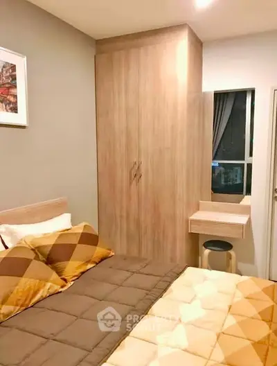 Cozy bedroom with stylish decor and ample storage in modern apartment