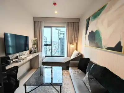 Modern living room with city view, stylish decor, and large TV