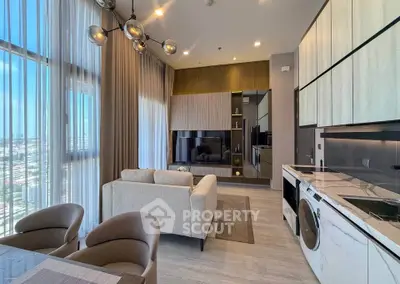 Modern living room with open kitchen, featuring stylish furniture and large windows with city view.