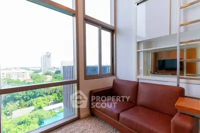 Modern living room with large windows and city view
