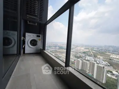 High-rise balcony with washing machine and panoramic city view