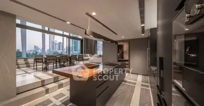 Luxurious open-layout kitchen with modern design and stunning city view, perfect for entertaining.