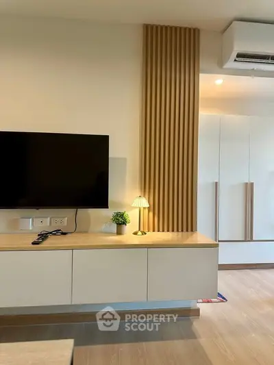 Modern living room with sleek TV unit and stylish decor